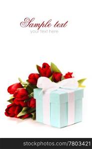 Single blue gift box with white ribbon and flowers on white background (with sample text)