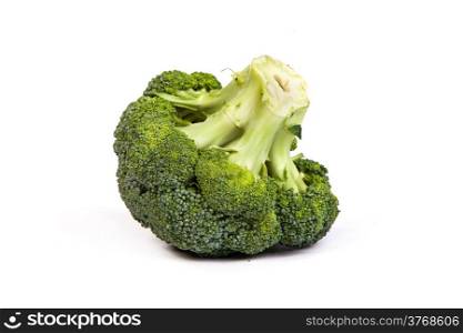 Single broccoli floret isolated on white background with soft drop shadow.