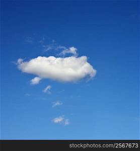 Single fluffy cloud in blue sky.