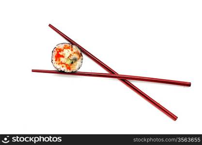 Single japan sushi roll in the chopsticks isolated