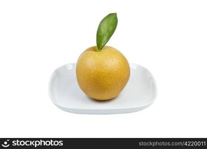 Single large apple pear in white plate on white background