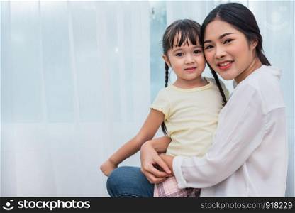 Single mom and daughter portrait. Happy family and people concept. Mother and Children day theme.
