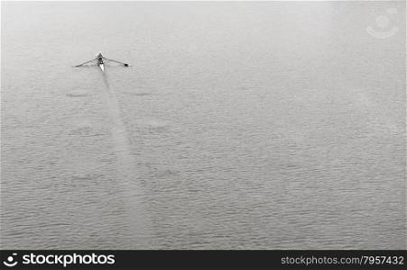 Single Person Rowing Sports Canoe on Calm Water Surface