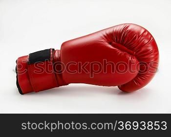 single red boxing glove isolated on white background