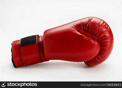 single red boxing glove isolated on white background