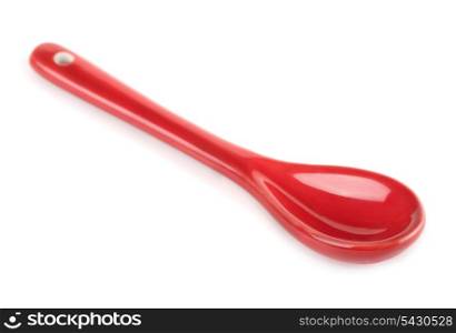 Single red porcelain spoon isolated on white