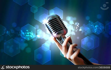 Single retro microphone against colourful background with lights