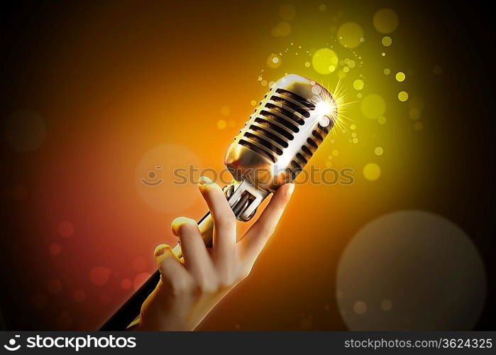 Single retro microphone against colourful background with lights