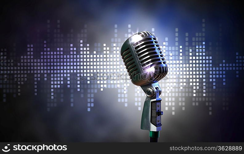 Single retro microphone against colourful background with lights