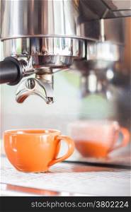 Single shot in orange cup of coffee, stock photo