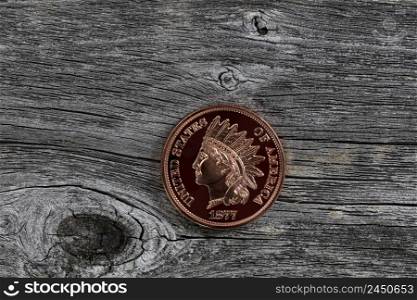 Single US Indian head one cent coin on rustic wooden boards for numismatic investment collecting