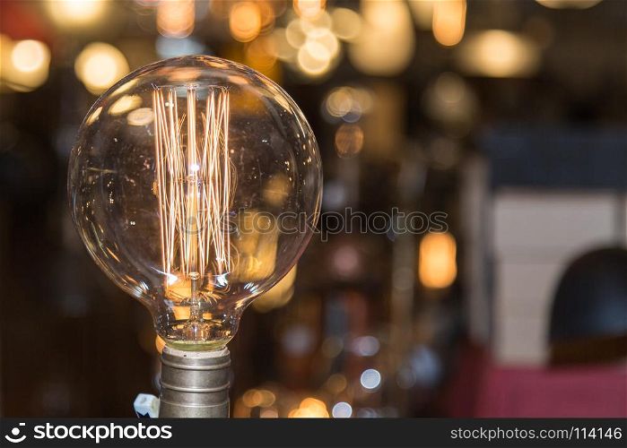 Single Vintage Electric Light Bulb with Incandescent Filament.. Single Vintage Electric Light Bulb with Incandescent Filament
