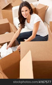 Single Woman Unpacking Boxes Moving House