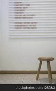Single wooden chair in minimal style room, stock photo