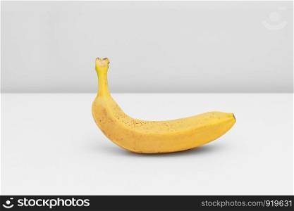 Single yellow ripe banana isolated on white background. Single yellow ripe banana isolated on white background. Fiber fruits