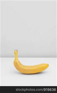 Single yellow ripe banana isolated on white background. Single yellow ripe banana isolated on white background. Fiber fruits