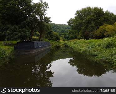Sinister black canal boat on River Avon