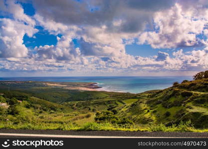 Sintra Portugal. 25 March 2017.View of Guincho beach and green fields sourouding from the road to Cabo da Roca in Sintra Portugal. Sintra, Portugal. photography by Ricardo Rocha.