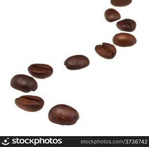 sinuous line pattern from roasted coffee beans with focus foreground
