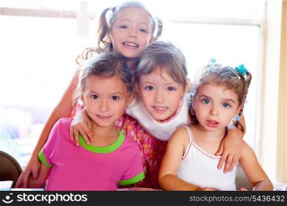 sister and friends kid girls in hug happy together posing looking camera