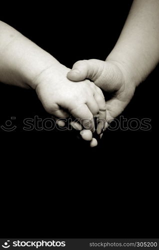 sister holding brothers hand