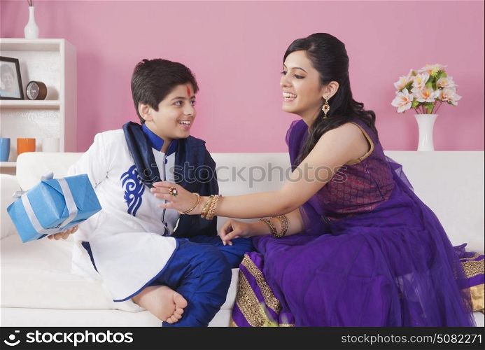 Sister snatching gift from her brother at the festival of Rakhi