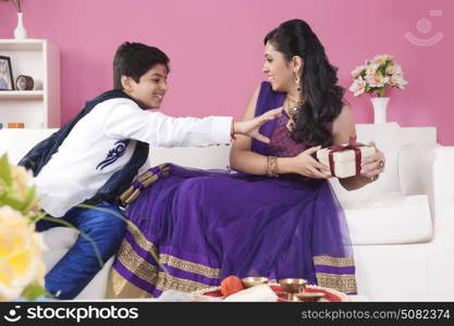 Sister snatching gift from her brother at the festival of Rakhi