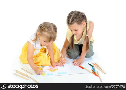 sisters draw on the album. Isolated on white background