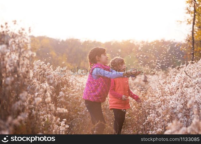 sisters, smiling girls at the outdoors