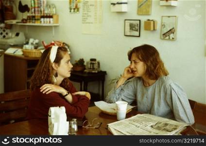 Sisters Talking at Cafe