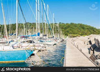 Sistiana, Trieste, Italy - July 28, 2015: Pleasure Boats moored in the harbor.