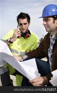 Site engineers with a walky talky
