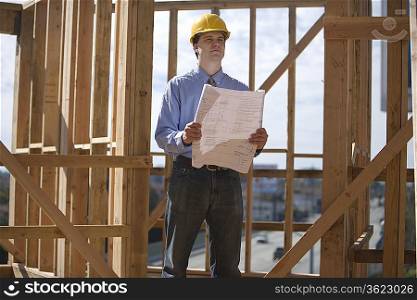 Site manager with building plans