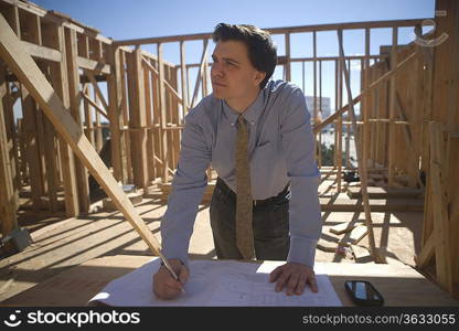 Site manager with building plans