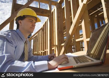 Site manager with laptop