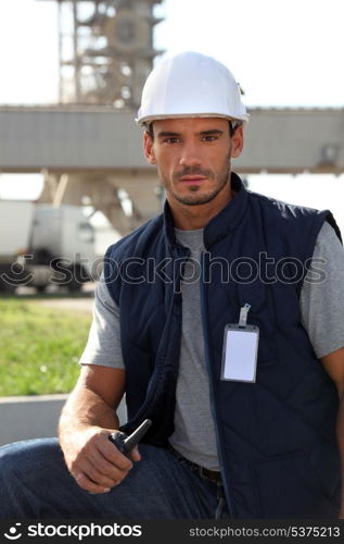 Site surveyor holding radio receiver