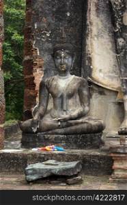 Sitting Buddha and big Buddha in old Sukhotai, Thailand