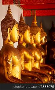 Sitting Buddha close up statues close up. Wat Pho temple, Bangkok, Thailand