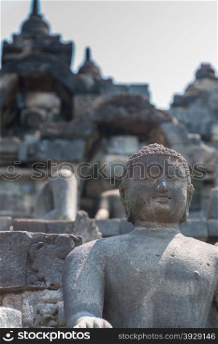 Sitting Buddha encarved in stone at Borobudur near Yogyakarta, Indonesia.