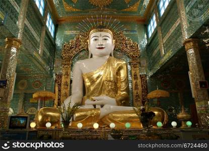 Sitting Buddha in tile temple, Sagaing, Mandalay, Myanmar