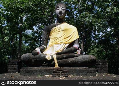 Sitting Buddha in wat in Si Satchanalai, Thailand