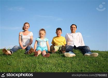 sitting family grass sky