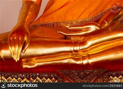 Sitting golden Buddha statue close up details. Wat Pho temple, Bangkok, Thailand