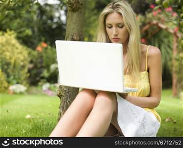 sitting with lap top computer open