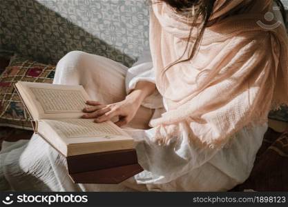 sitting woman reading quran. Resolution and high quality beautiful photo. sitting woman reading quran. High quality beautiful photo concept