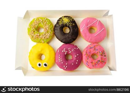 six round different donuts with sprinkles in a paper white box isolated on white background, top view
