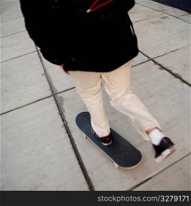 Skateboard on sidewalk in Boston, Massachusetts, USA