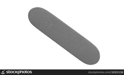 Skateboard rotates on white background