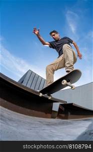 Skateboarder doing a nose slide trick  on a urban scene.