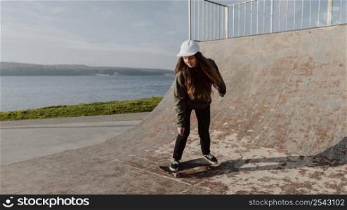 skateboarder girl ramp long shot